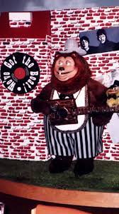 Billy Bob animatronic in black and white magician themed overalls.