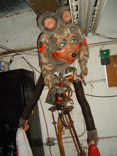 The second generation Mitzi animatronic. She has her head but is missing all other cosmetics, exposing her mechanism.