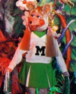 A very early version of the Mitzi Mozzarella animatronic with straight braids.