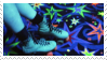 Rollerskates against a colorful carpet.